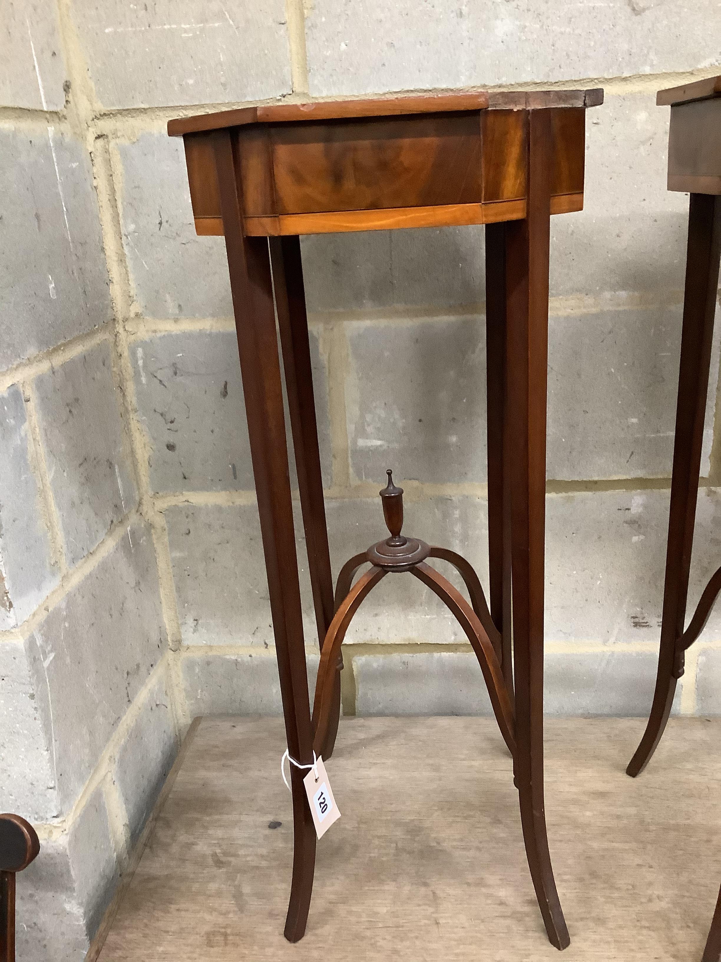 A pair of Sheraton style octagonal inlaid mahogany urn stands, width 33cm, height 75cm